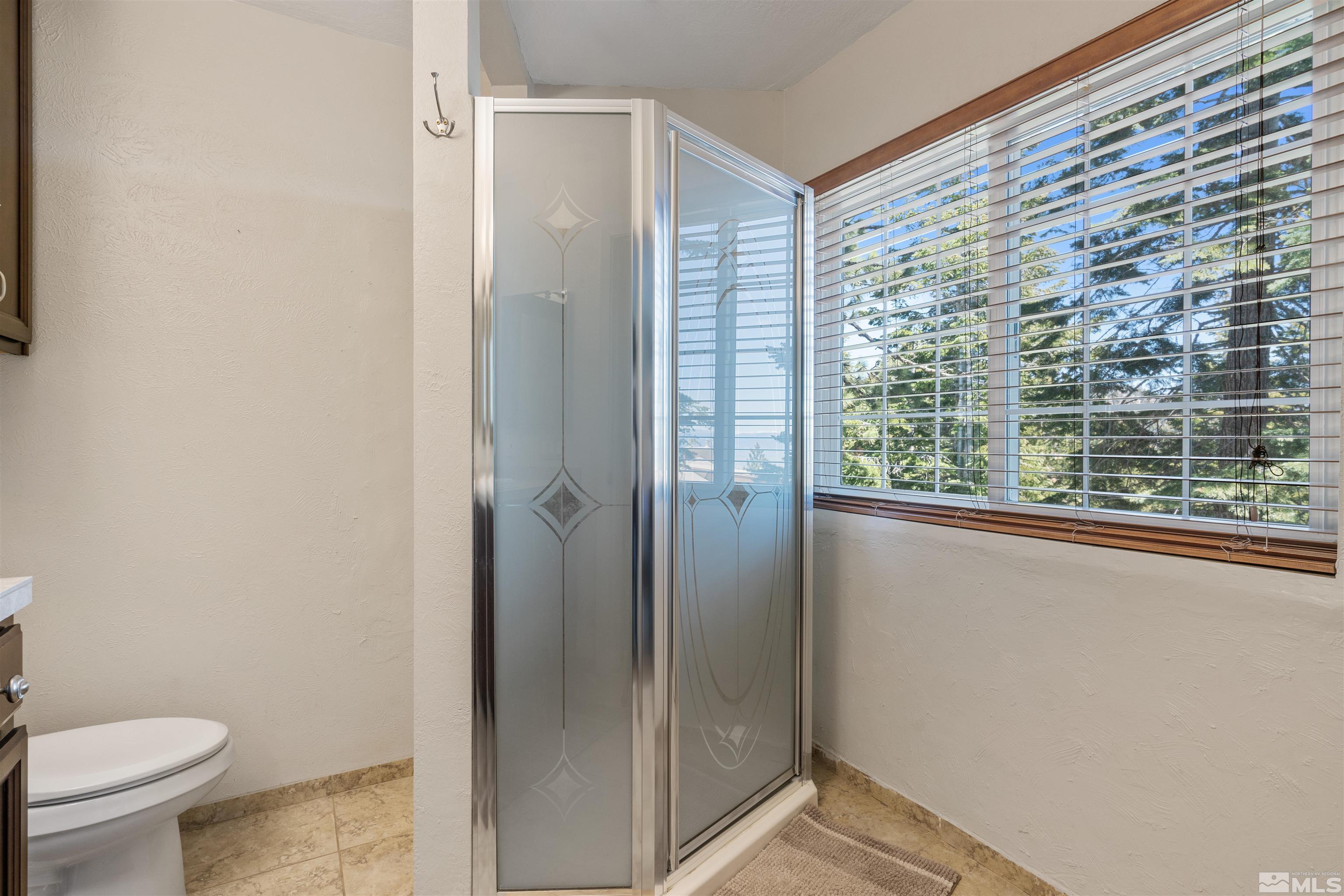 754 Boulder Court, Unit 9 Stateline, NV 89449 - Photo 24 of 38 a bathroom with a granite countertop sink toilet and shower