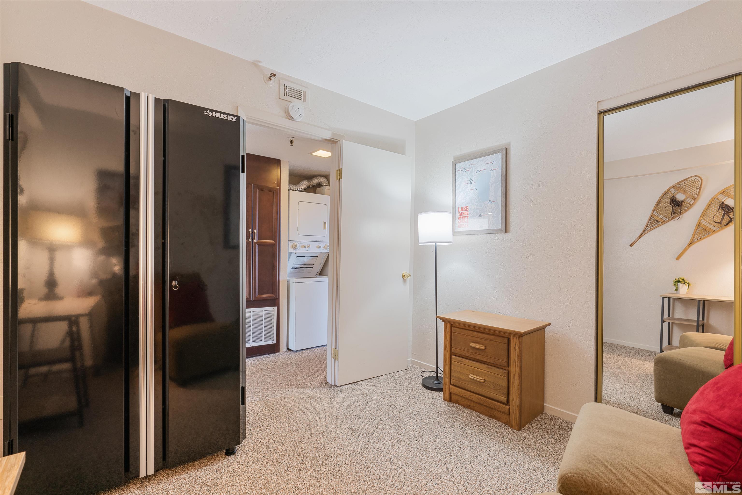 754 Boulder Court, Unit 9 Stateline, NV 89449 - Photo 26 of 38 a living room with a couch and a refrigerator