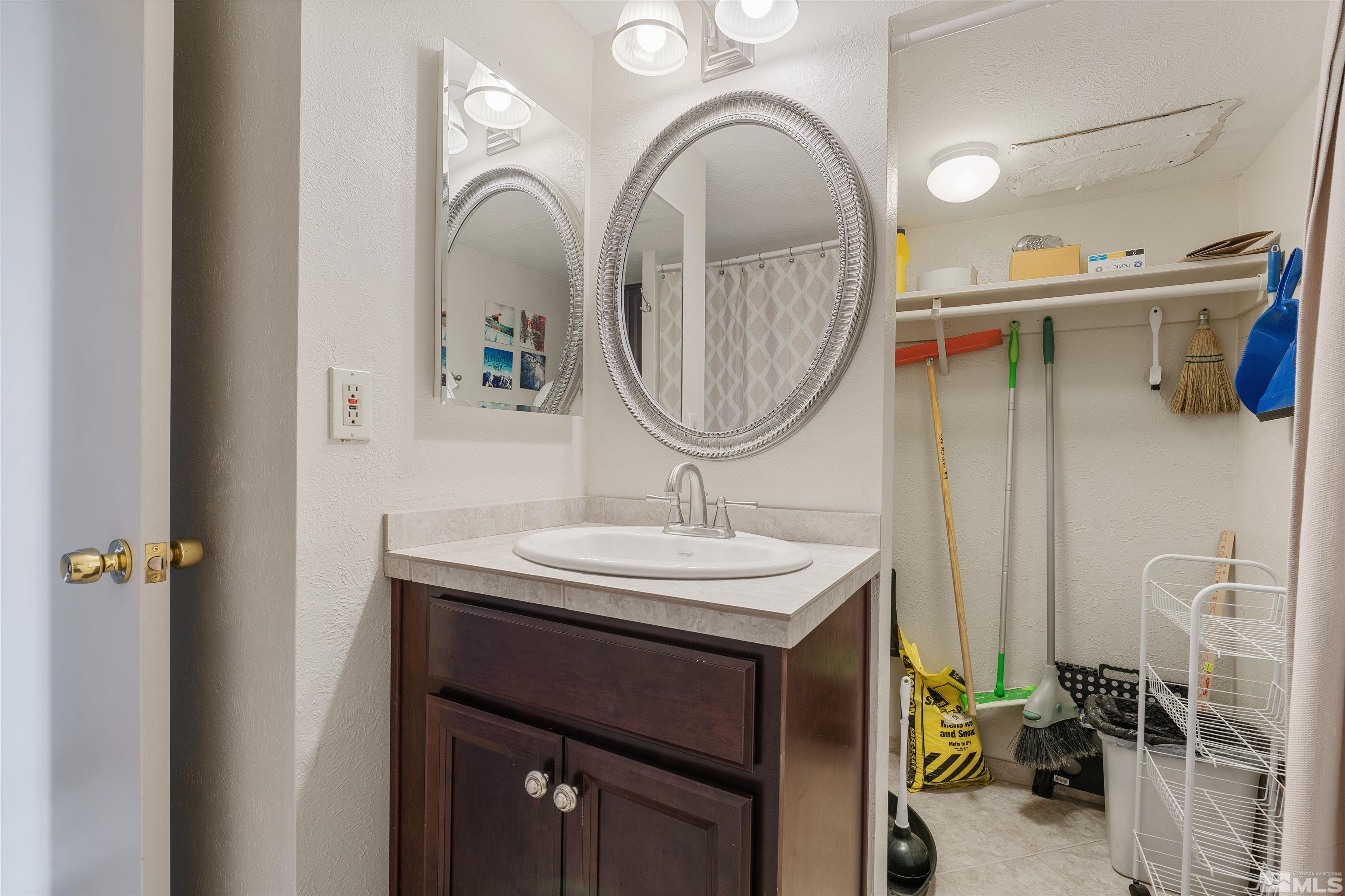 754 Boulder Court, Unit 9 Stateline, NV 89449 - Photo 30 of 38 a bathroom with a sink and a mirror