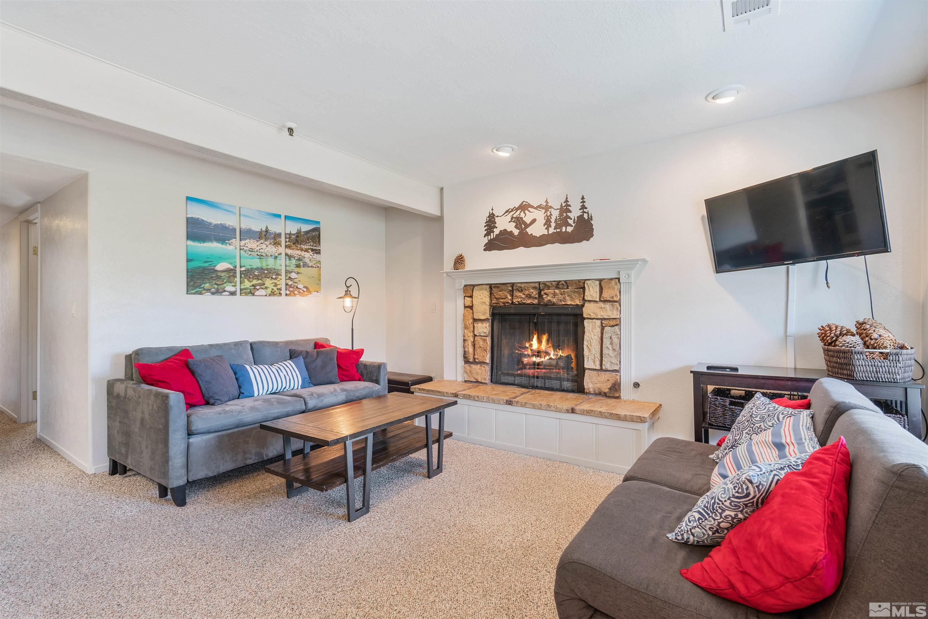 754 Boulder Court, Unit 9 Stateline, NV 89449 - Photo 4 of 38 a living room with furniture and a flat screen tv