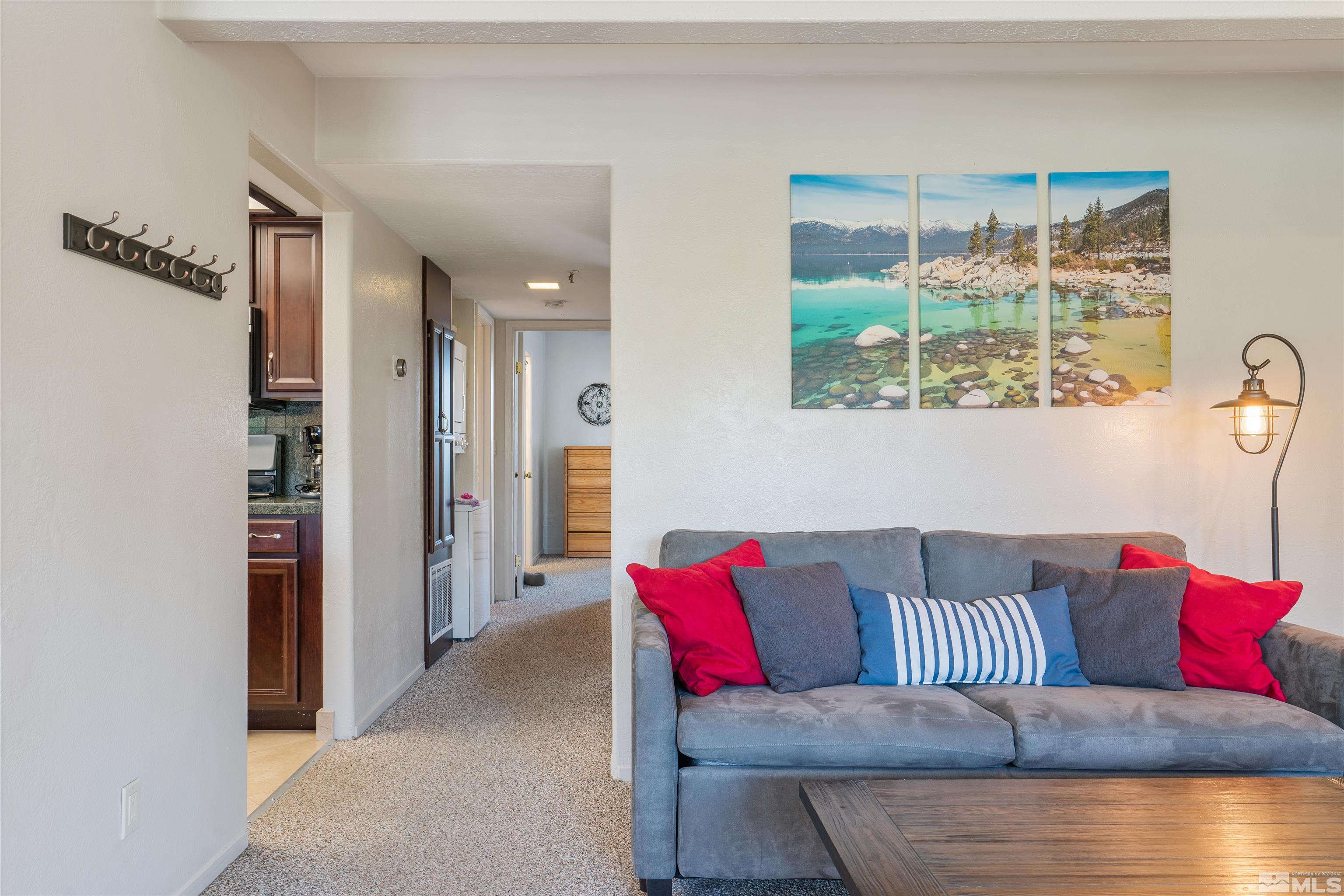 754 Boulder Court, Unit 9 Stateline, NV 89449 - Photo 5 of 38 a living room with furniture and a large window