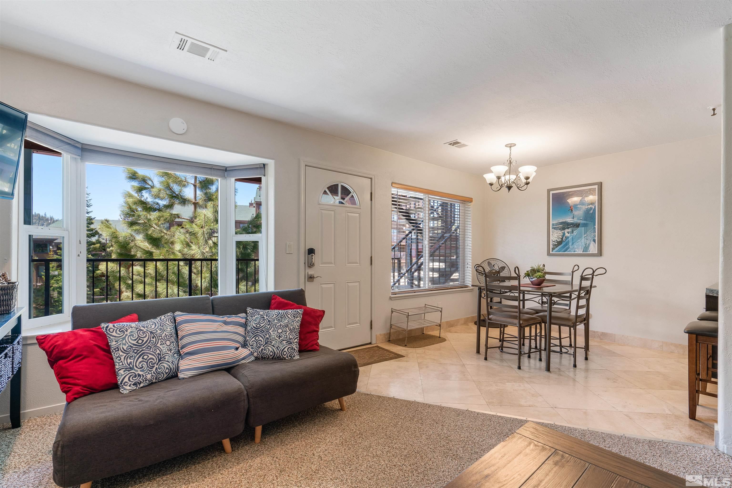754 Boulder Court, Unit 9 Stateline, NV 89449 - Photo 7 of 38 a living room with furniture and a large window