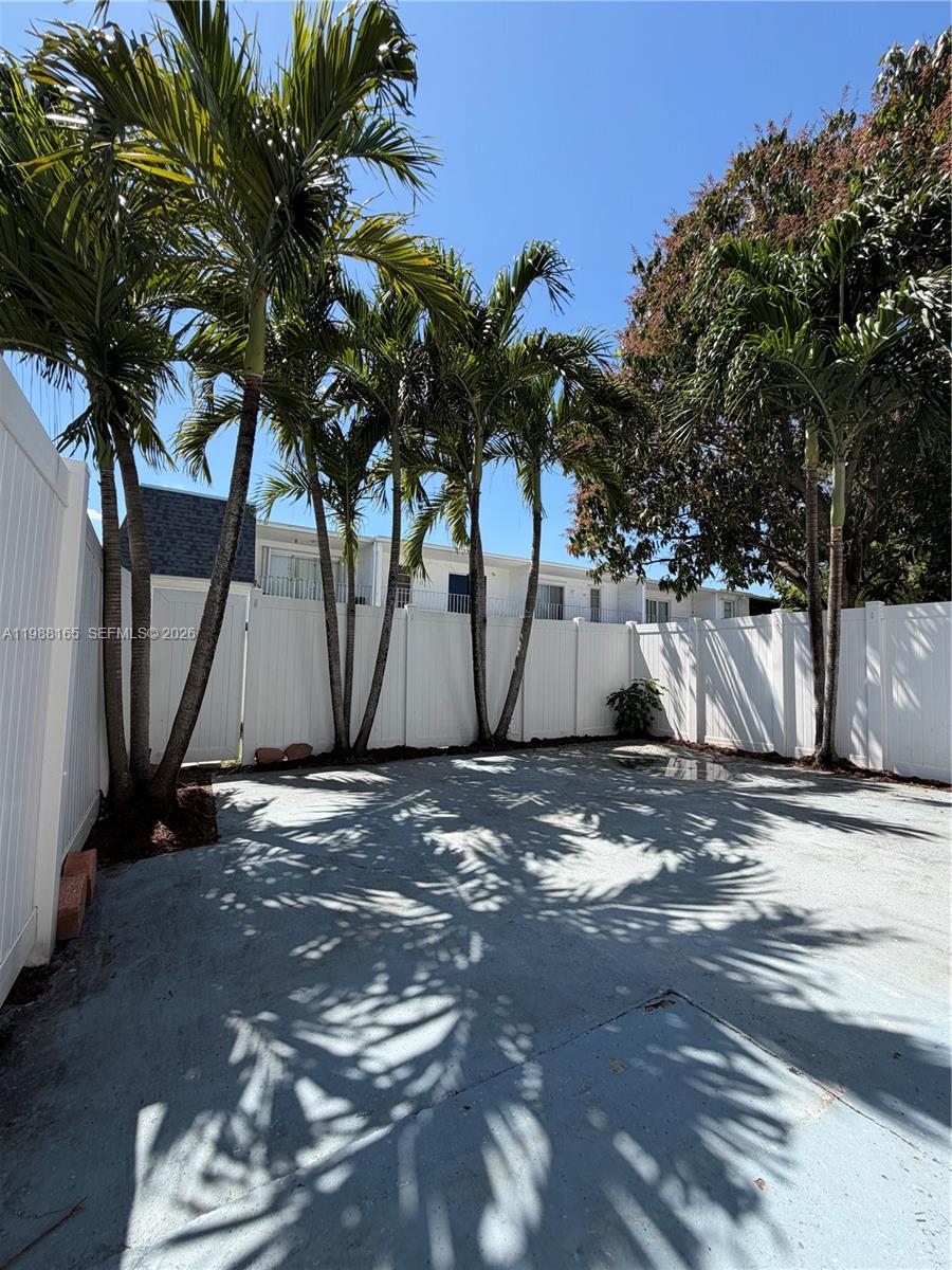 6760 Southwest 40th Street, Unit 41 Davie, FL 33314 - Photo 17 of 51 a view of a backyard with large trees