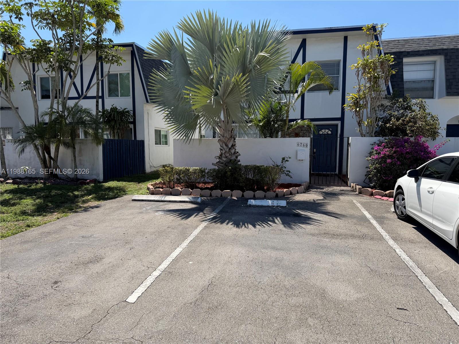 6760 Southwest 40th Street, Unit 41 Davie, FL 33314 - Photo 2 of 51 a view of a patio with table and chairs and potted plants