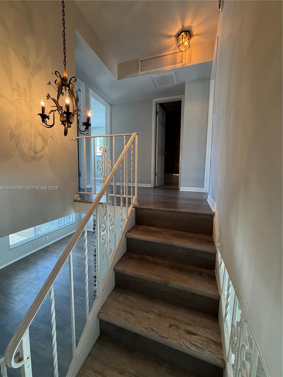 6760 Southwest 40th Street, Unit 41 Davie, FL 33314 - Photo 22 of 51 a view of entryway and hall with wooden floor