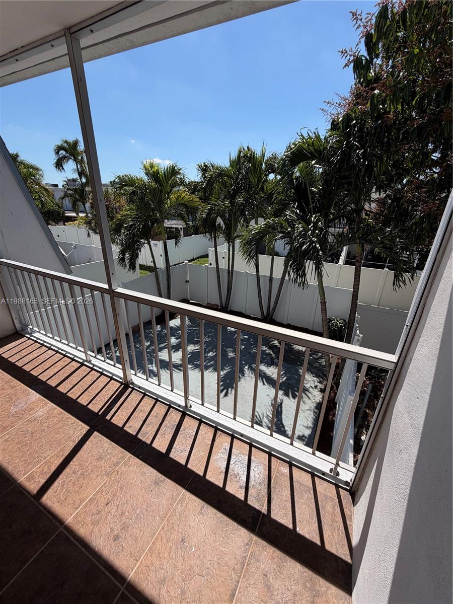 6760 Southwest 40th Street, Unit 41 Davie, FL 33314 - Photo 35 of 51 a view of a balcony with wooden floor