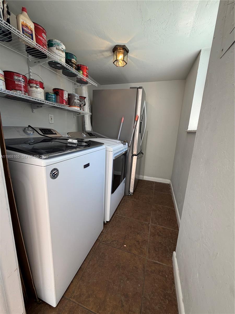 6760 Southwest 40th Street, Unit 41 Davie, FL 33314 - Photo 36 of 51 a utility room with dryer and washer