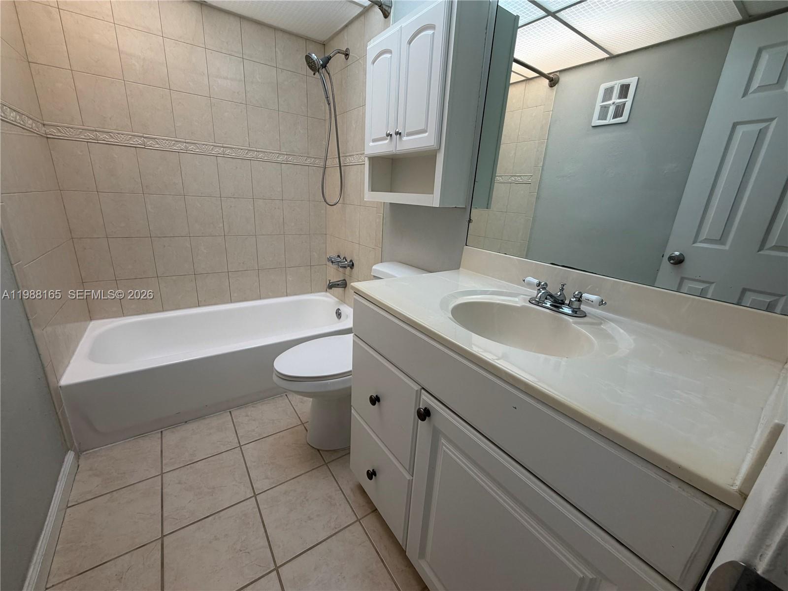 6760 Southwest 40th Street, Unit 41 Davie, FL 33314 - Photo 37 of 51 a bathroom with a sink a toilet and shower
