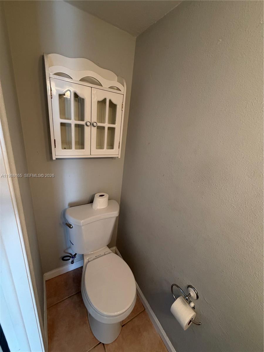 6760 Southwest 40th Street, Unit 41 Davie, FL 33314 - Photo 43 of 51 a bathroom with a toilet