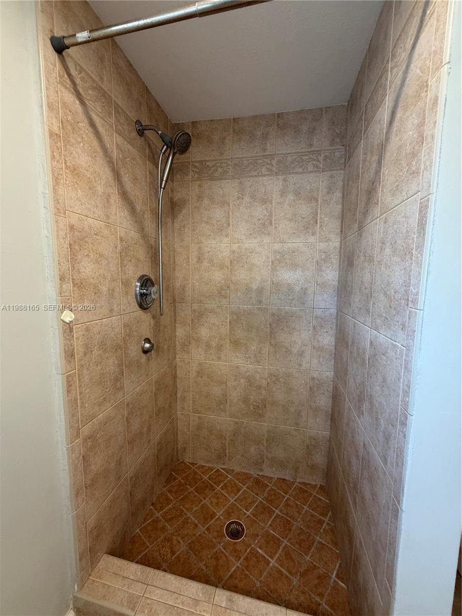 6760 Southwest 40th Street, Unit 41 Davie, FL 33314 - Photo 44 of 51 a bathroom with a shower
