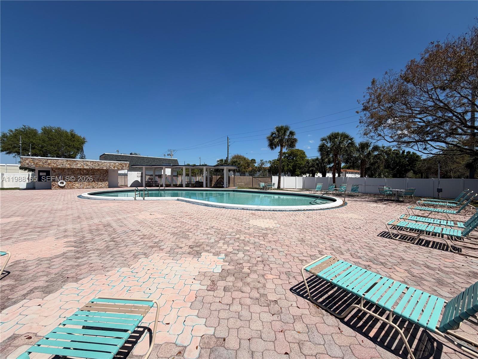 6760 Southwest 40th Street, Unit 41 Davie, FL 33314 - Photo 49 of 51 a view of a yard with furniture
