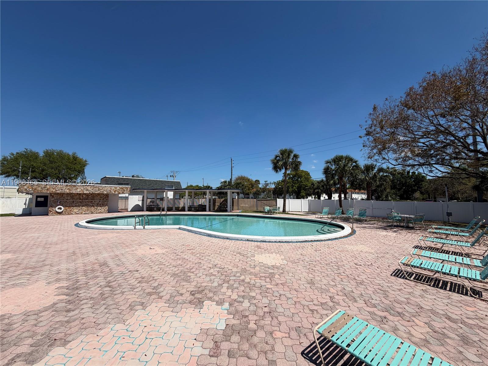 6760 Southwest 40th Street, Unit 41 Davie, FL 33314 - Photo 50 of 51 a view of a backyard with swimming pool
