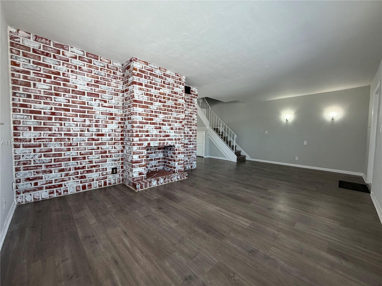 6760 Southwest 40th Street, Unit 41 Davie, FL 33314 - Photo 5 of 51 a view of an empty room with wooden floor
