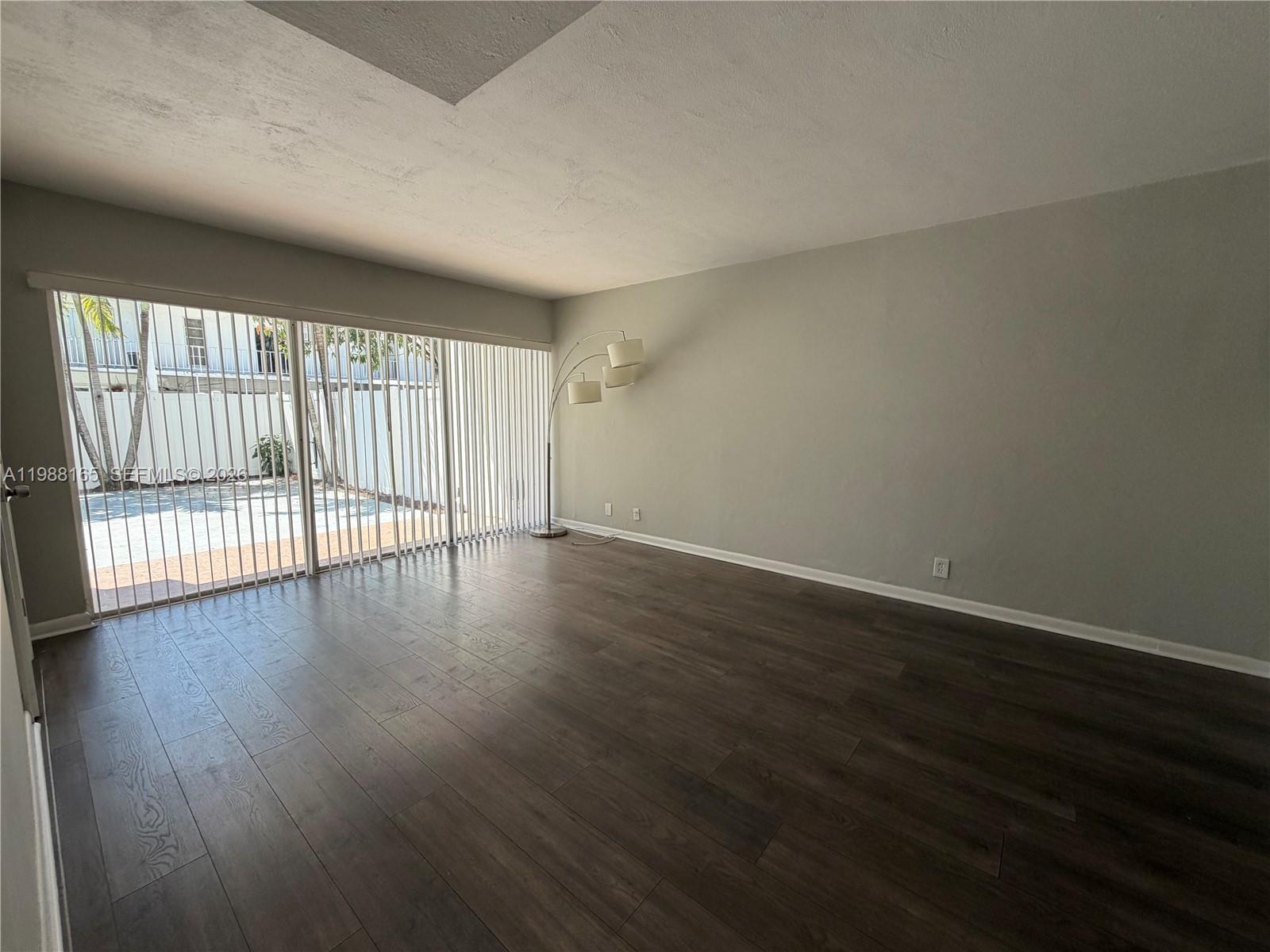 6760 Southwest 40th Street, Unit 41 Davie, FL 33314 - Photo 9 of 51 a view of wooden floor and windows in a room
