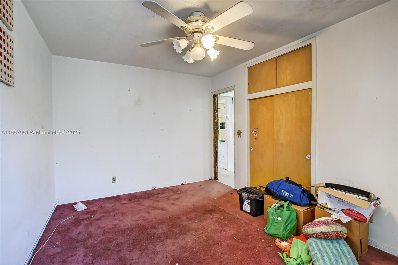 4315 West Park Road Hollywood, FL 33021 - Photo 16 of 24 a bedroom with a bed and a chandelier