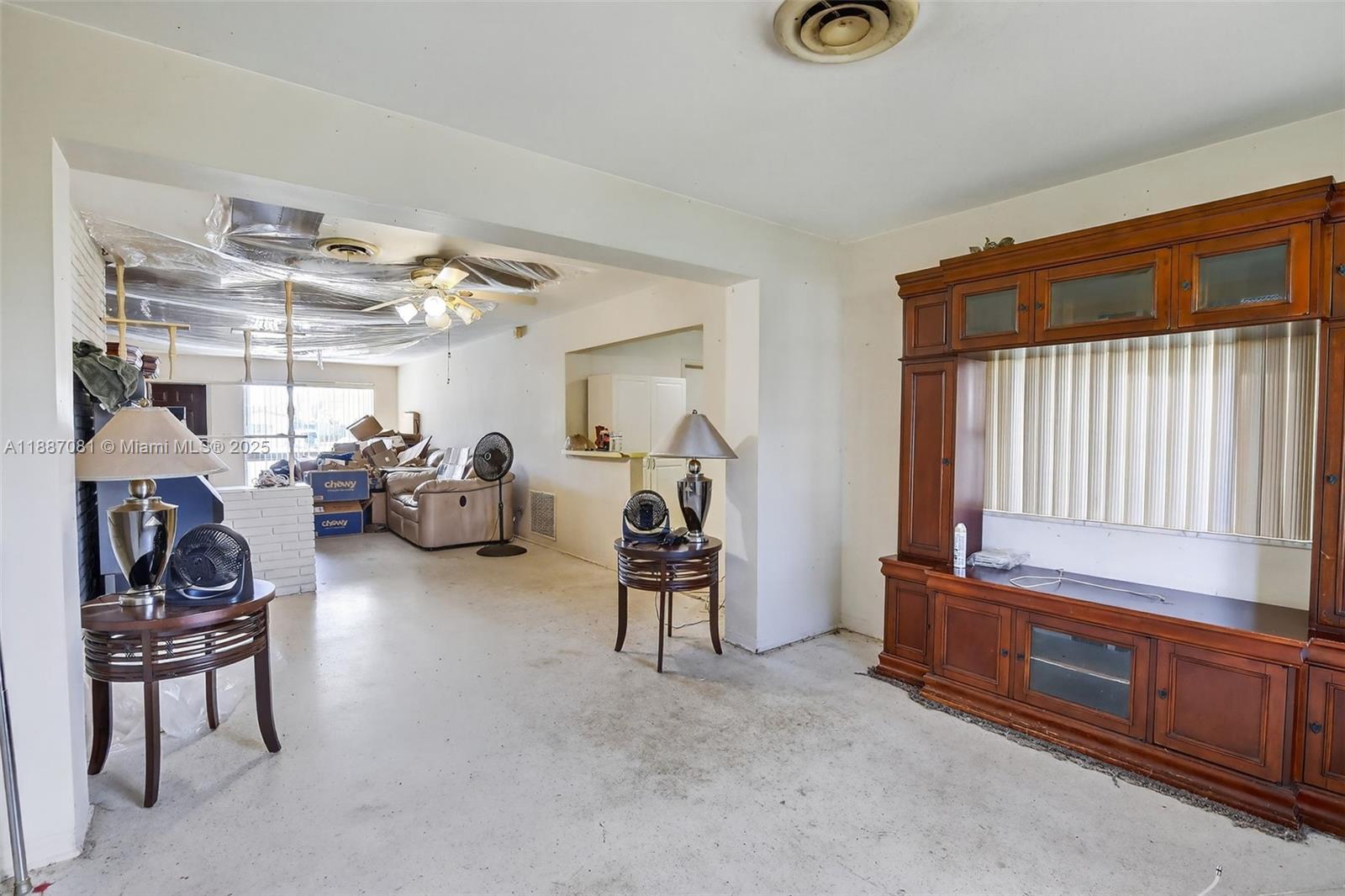 4315 West Park Road Hollywood, FL 33021 - Photo 8 of 24 a living room with furniture and a window