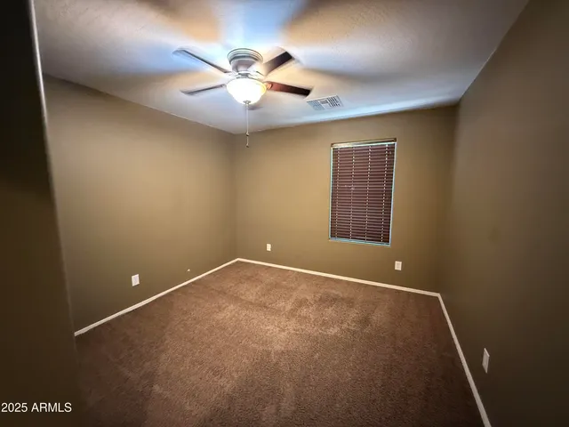 en view of an empty room with a window