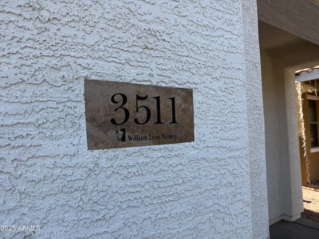 a brick building with a street sign on it