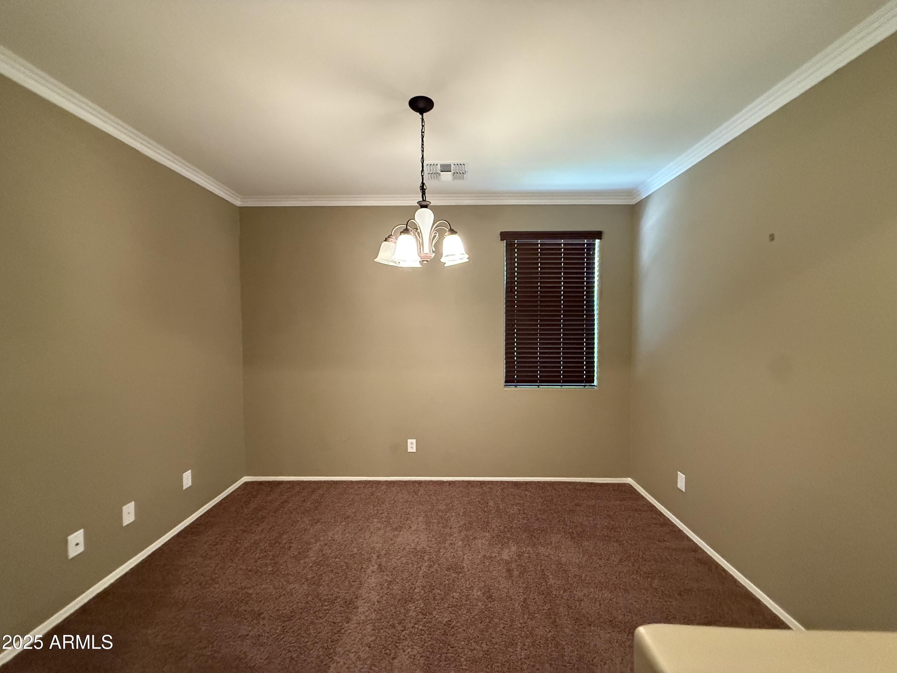 3511 East Tulsa Street Gilbert, AZ 85295 - Photo 5 of 30 a view of an empty room with a window