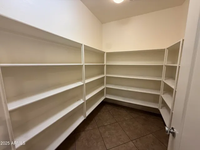 a storage room with a wooden floor