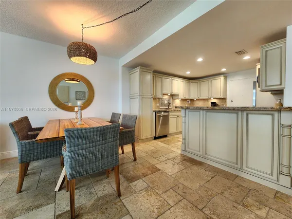 a view of a dining room kitchen and a window