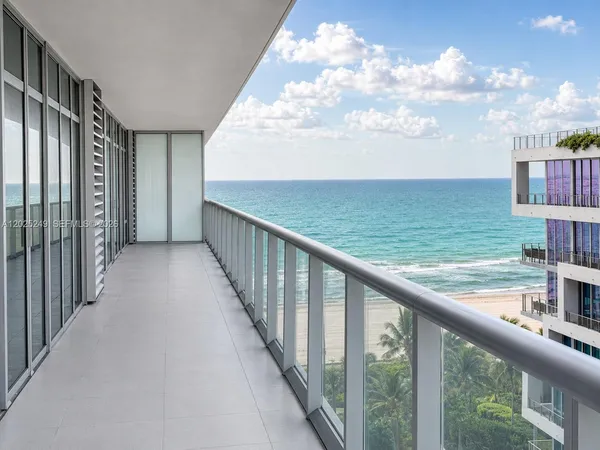 a view of a balcony with an ocean view