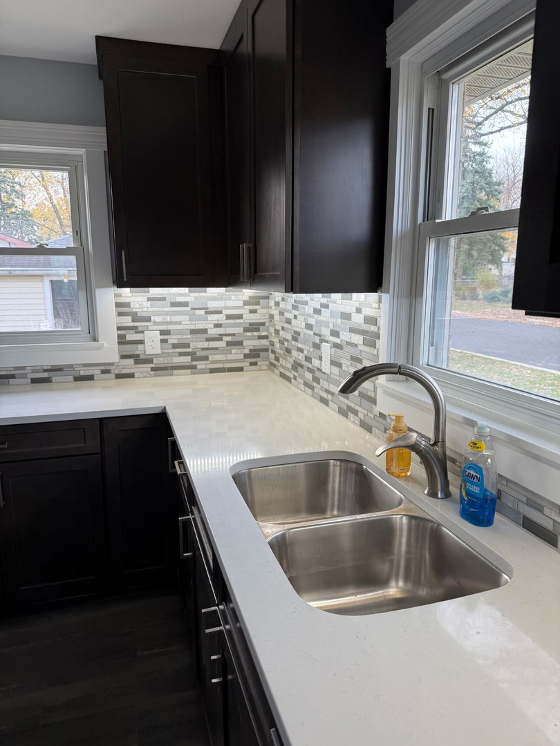 601 East 10th Street Lockport, IL 60441 - Photo 11 of 11 a kitchen with a sink and a microwave
