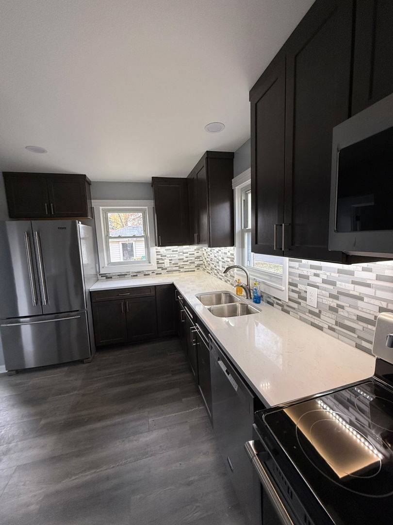 601 East 10th Street Lockport, IL 60441 - Photo 10 of 11 a kitchen with stainless steel appliances a sink stove and refrigerator