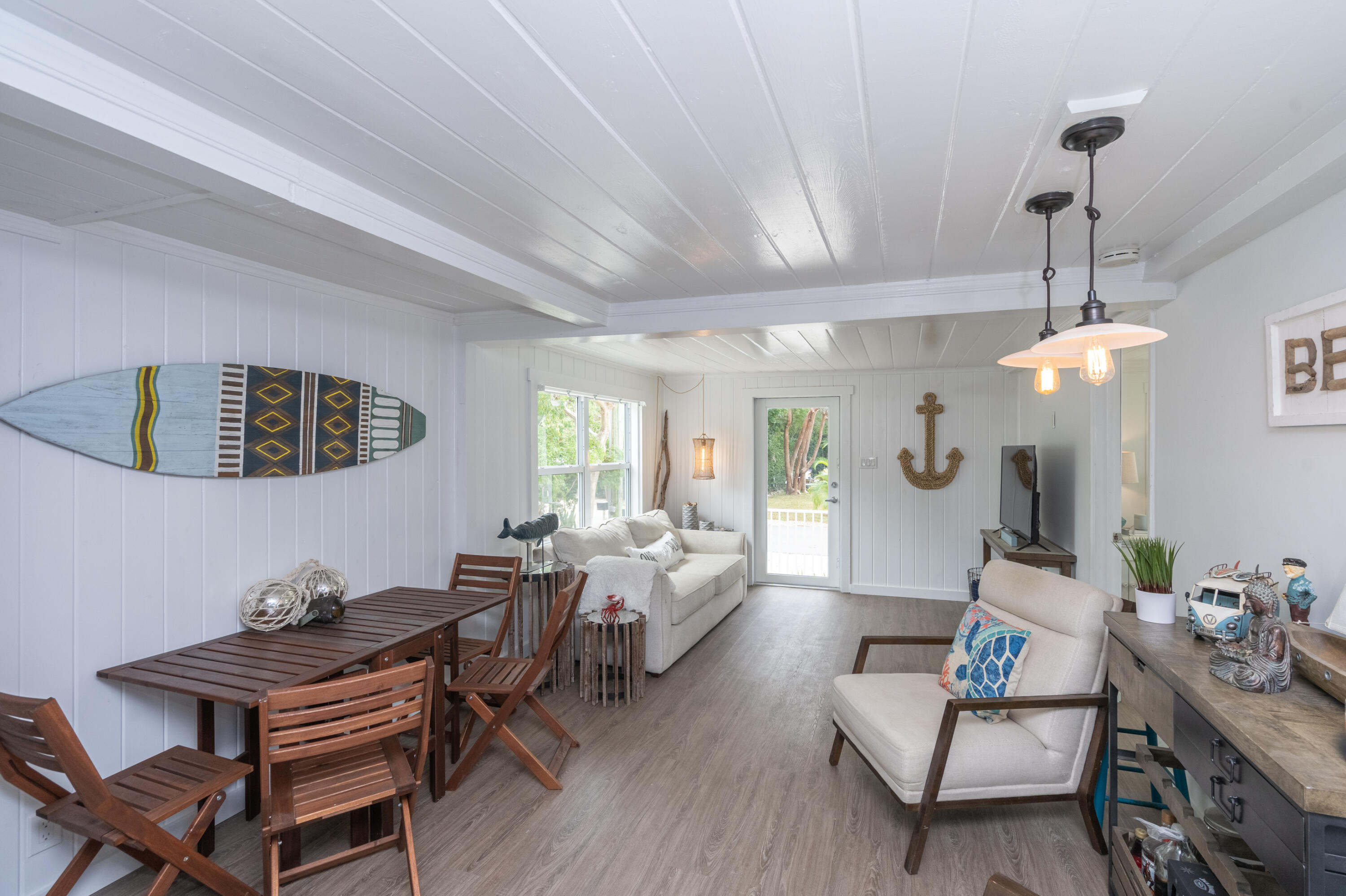 124 South Bay Harbor Drive Key Largo, FL 33037 - Photo 13 of 28 a living room with furniture and wooden floor