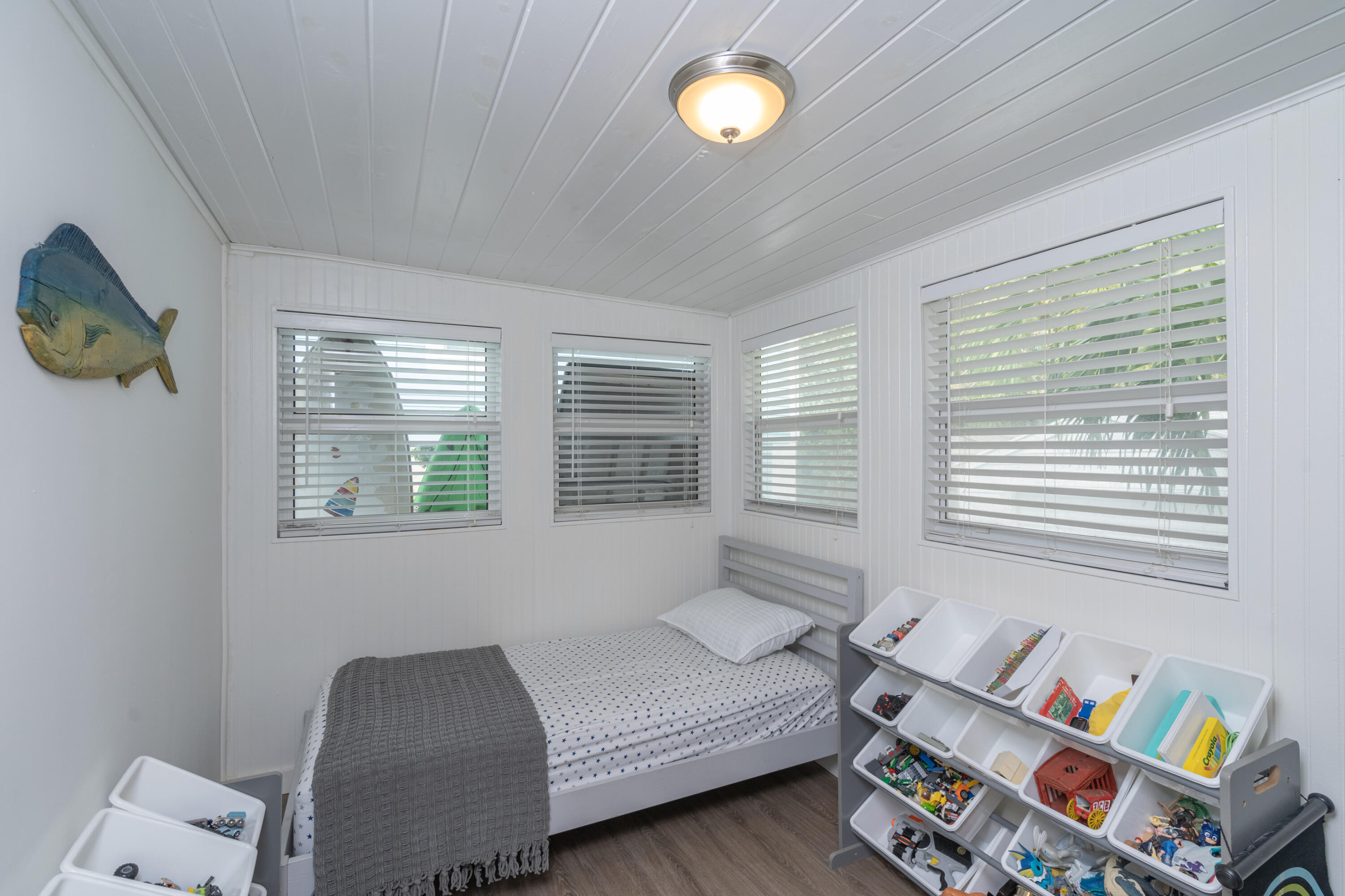124 South Bay Harbor Drive Key Largo, FL 33037 - Photo 17 of 28 a bedroom with furniture and a window