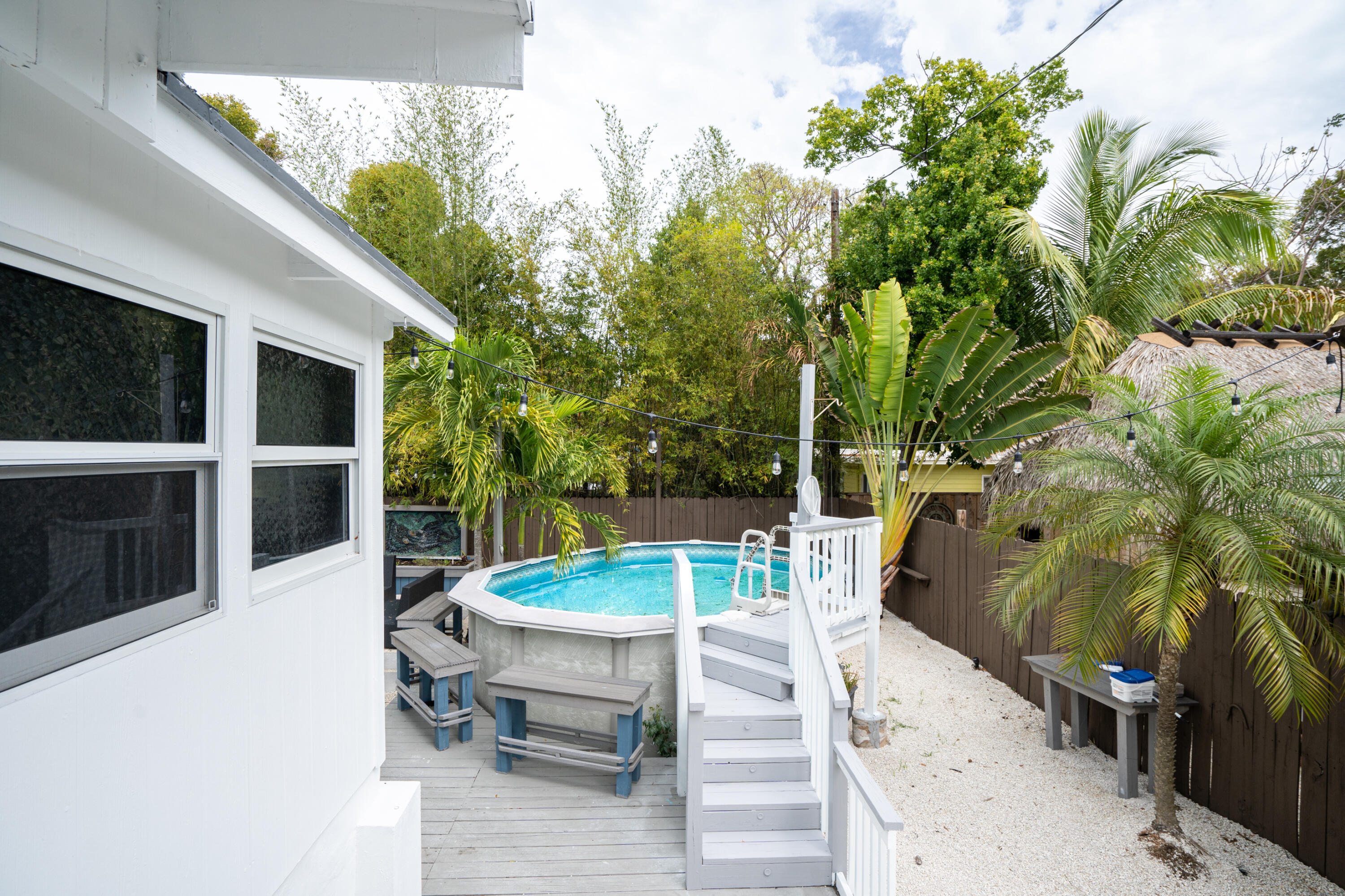 124 South Bay Harbor Drive Key Largo, FL 33037 - Photo 22 of 28 a view of a backyard with furniture
