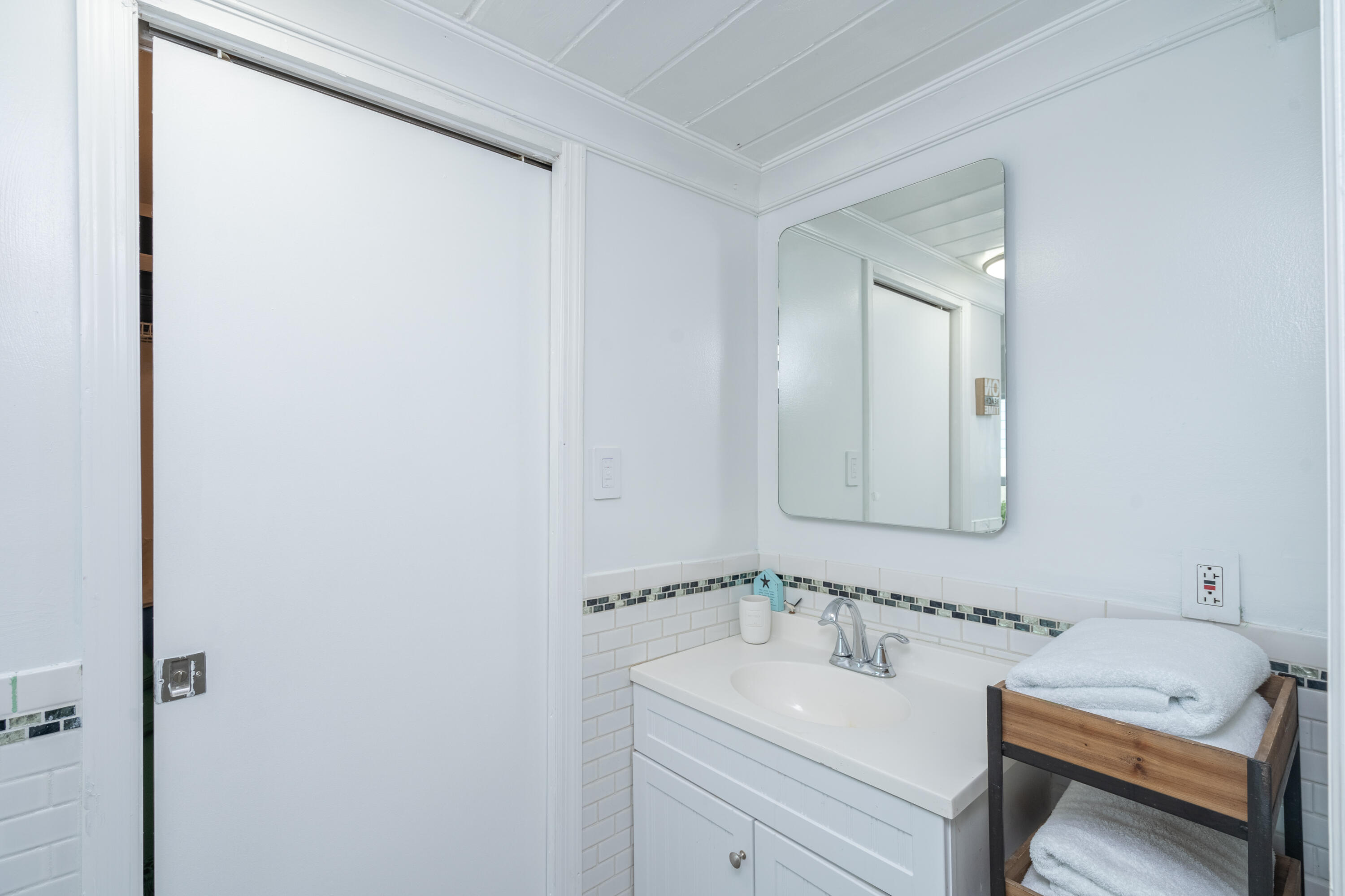 124 South Bay Harbor Drive Key Largo, FL 33037 - Photo 7 of 28 a bathroom with a sink and a mirror