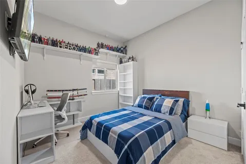 a bedroom with a bed and a table in it