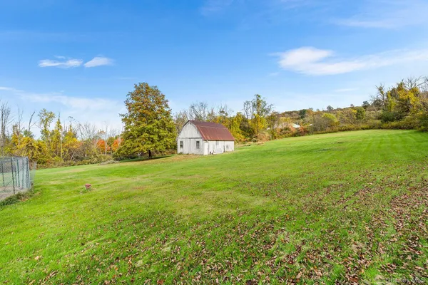 a view of a field with an trees