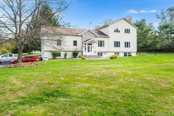 a view of a house with a big yard