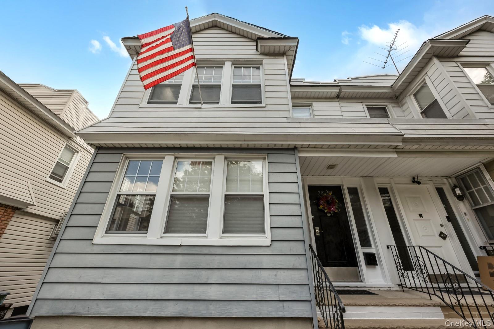 a view of a building with a balcony and stairs