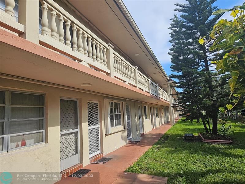 Ives Estates Miami, FL 33179 - Photo 3 of 4 a front view of a house with a yard