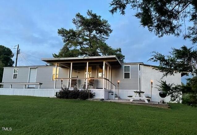 529 Flanagan Road Henderson, NC 27537 - Photo 1 of 38 a house view with a garden space