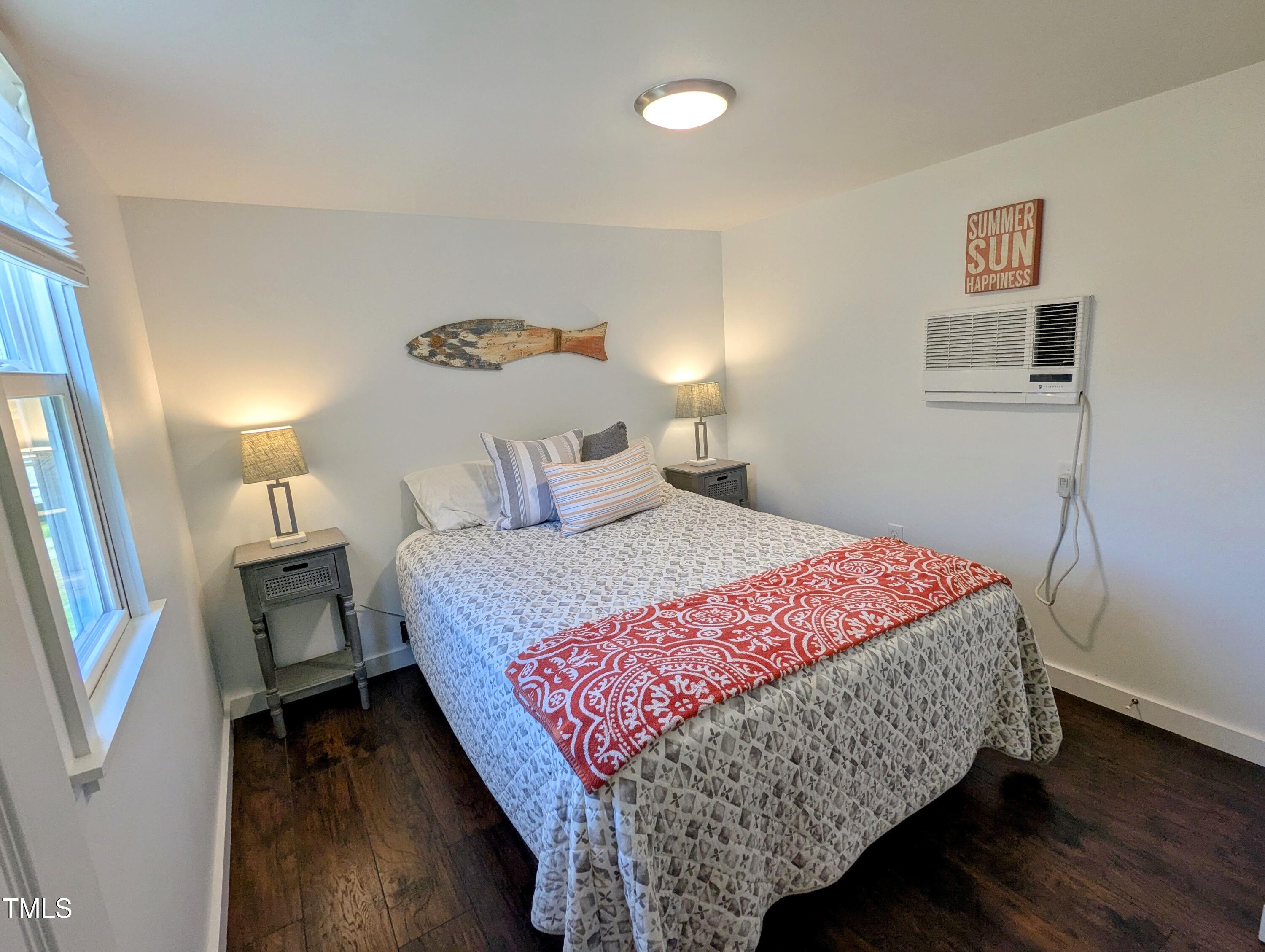 529 Flanagan Road Henderson, NC 27537 - Photo 21 of 38 a bedroom with a bed and a night stand