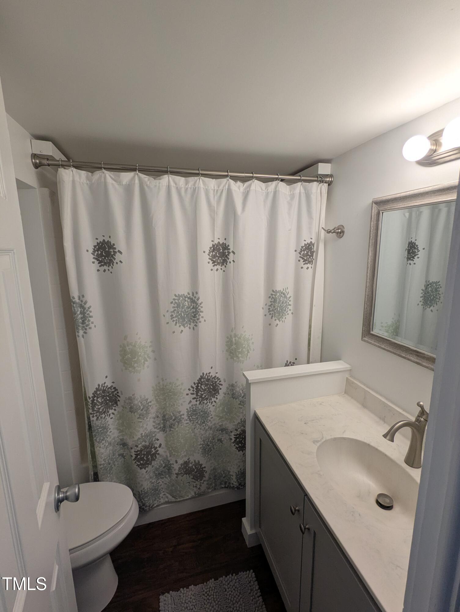 529 Flanagan Road Henderson, NC 27537 - Photo 22 of 38 a bathroom with a granite countertop sink toilet and shower
