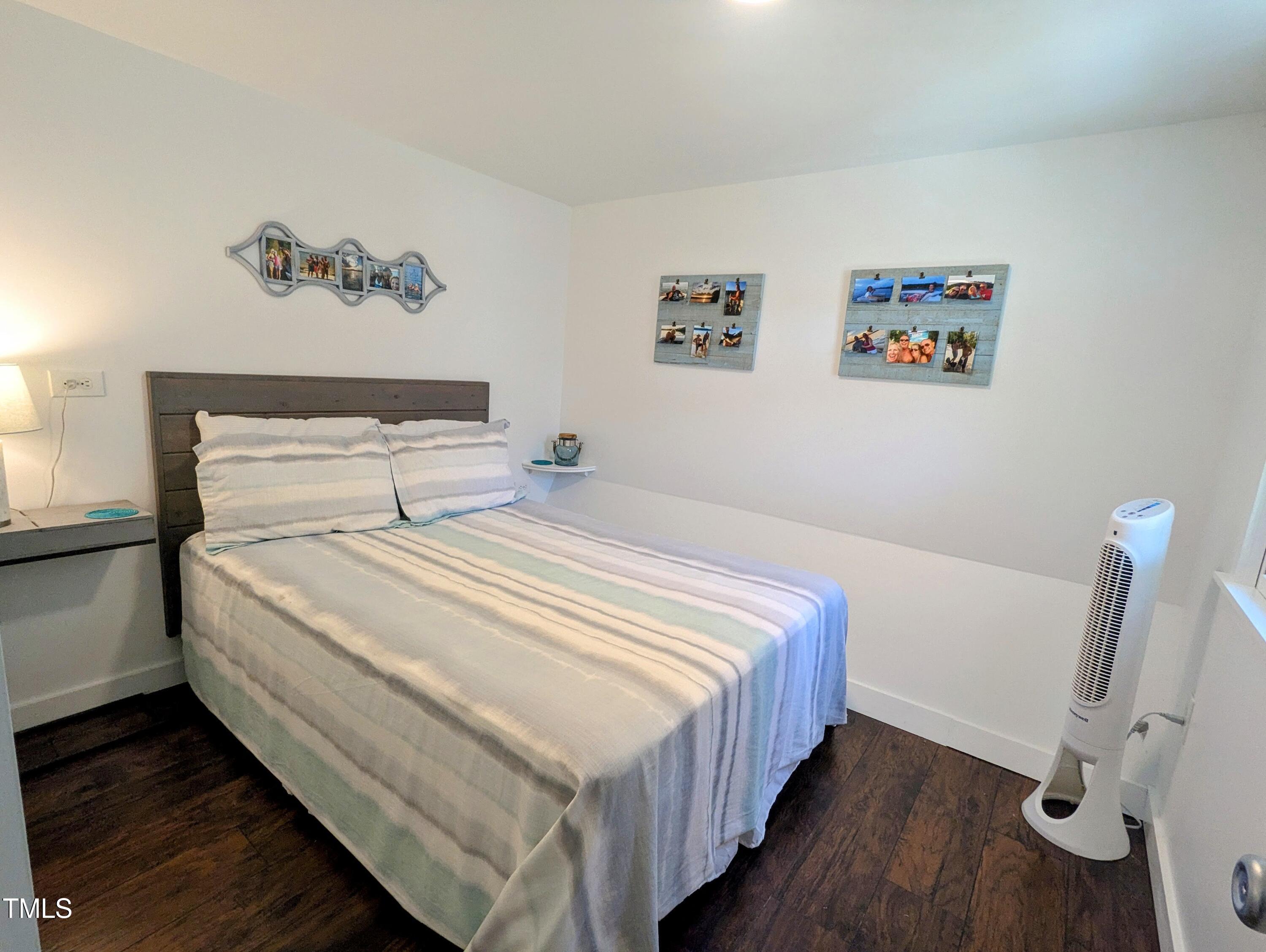 529 Flanagan Road Henderson, NC 27537 - Photo 25 of 38 a bedroom with bed and wooden floor