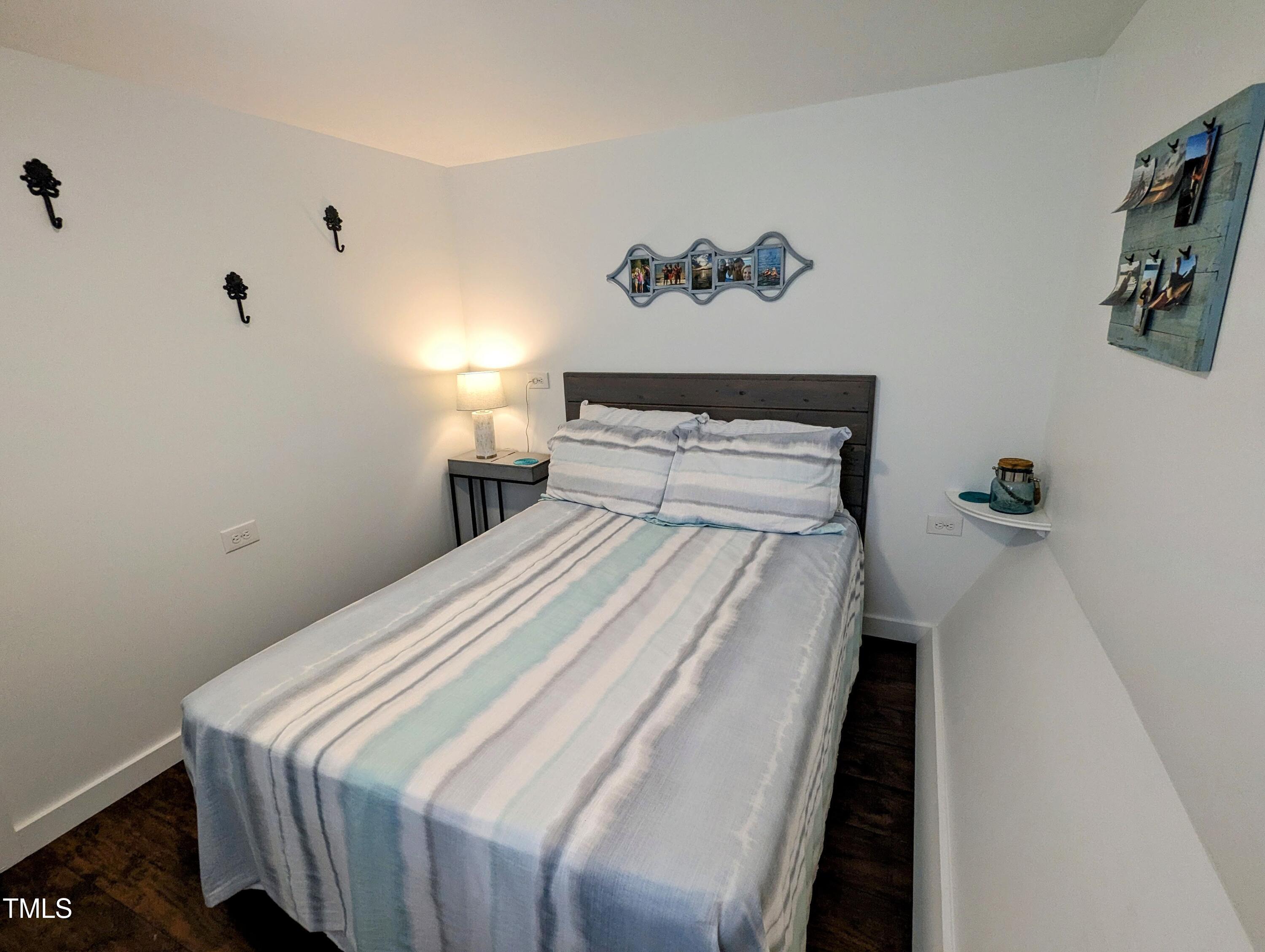 529 Flanagan Road Henderson, NC 27537 - Photo 26 of 38 a bedroom with a bed and painting on the wall