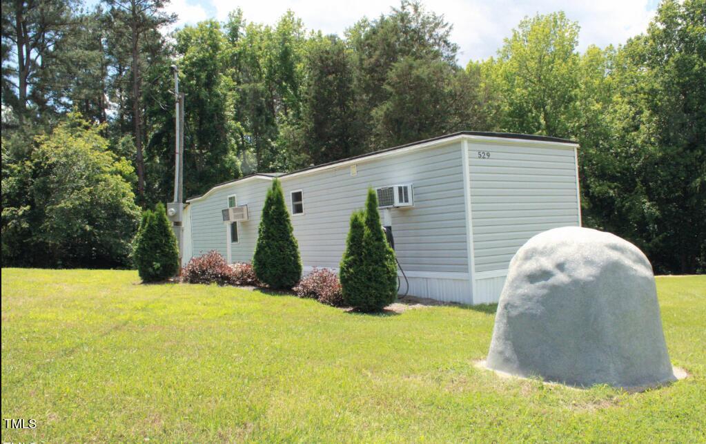 529 Flanagan Road Henderson, NC 27537 - Photo 2 of 38 a view of a back yard of the house