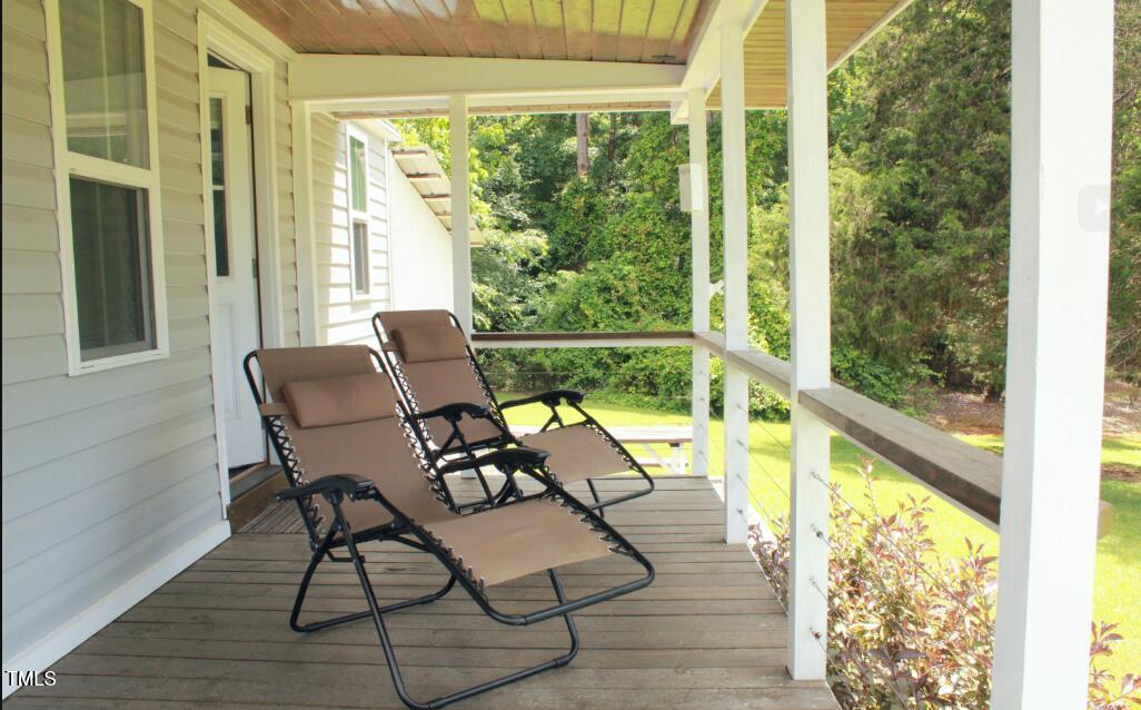 529 Flanagan Road Henderson, NC 27537 - Photo 3 of 38 a view of a chairs and table in patio