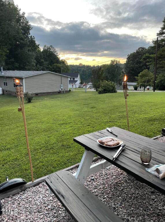 529 Flanagan Road Henderson, NC 27537 - Photo 6 of 38 a view of a backyard with sitting area