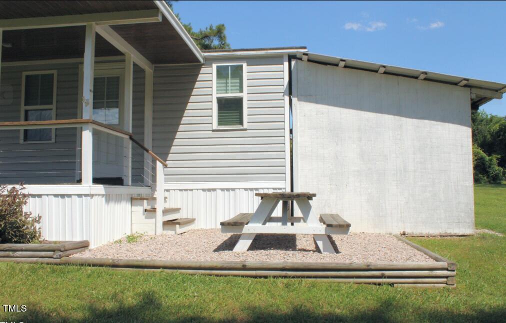 529 Flanagan Road Henderson, NC 27537 - Photo 7 of 38 a front view of a house with a yard