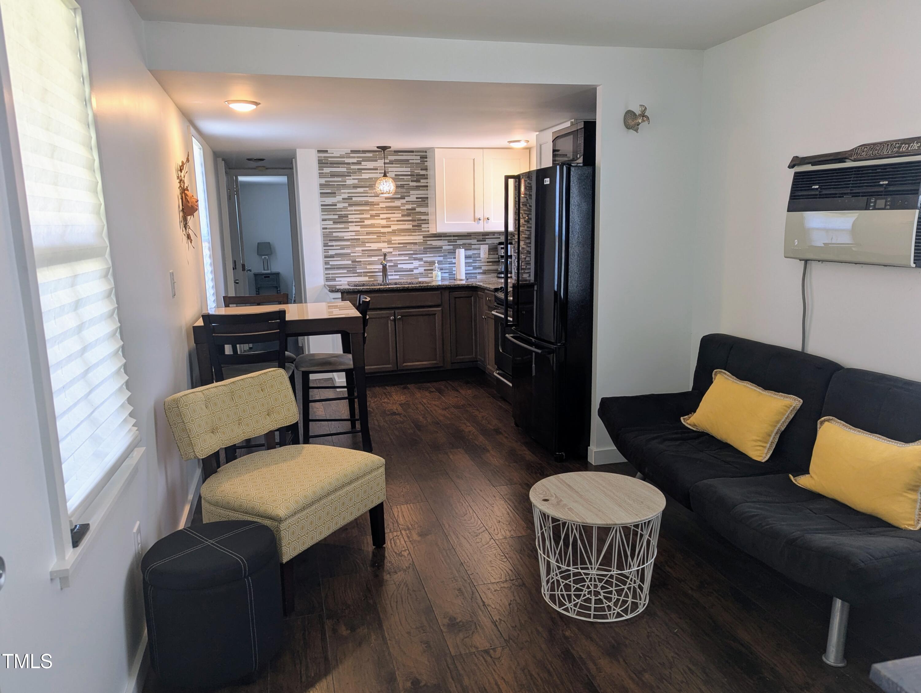 529 Flanagan Road Henderson, NC 27537 - Photo 8 of 38 a living room with furniture and a table