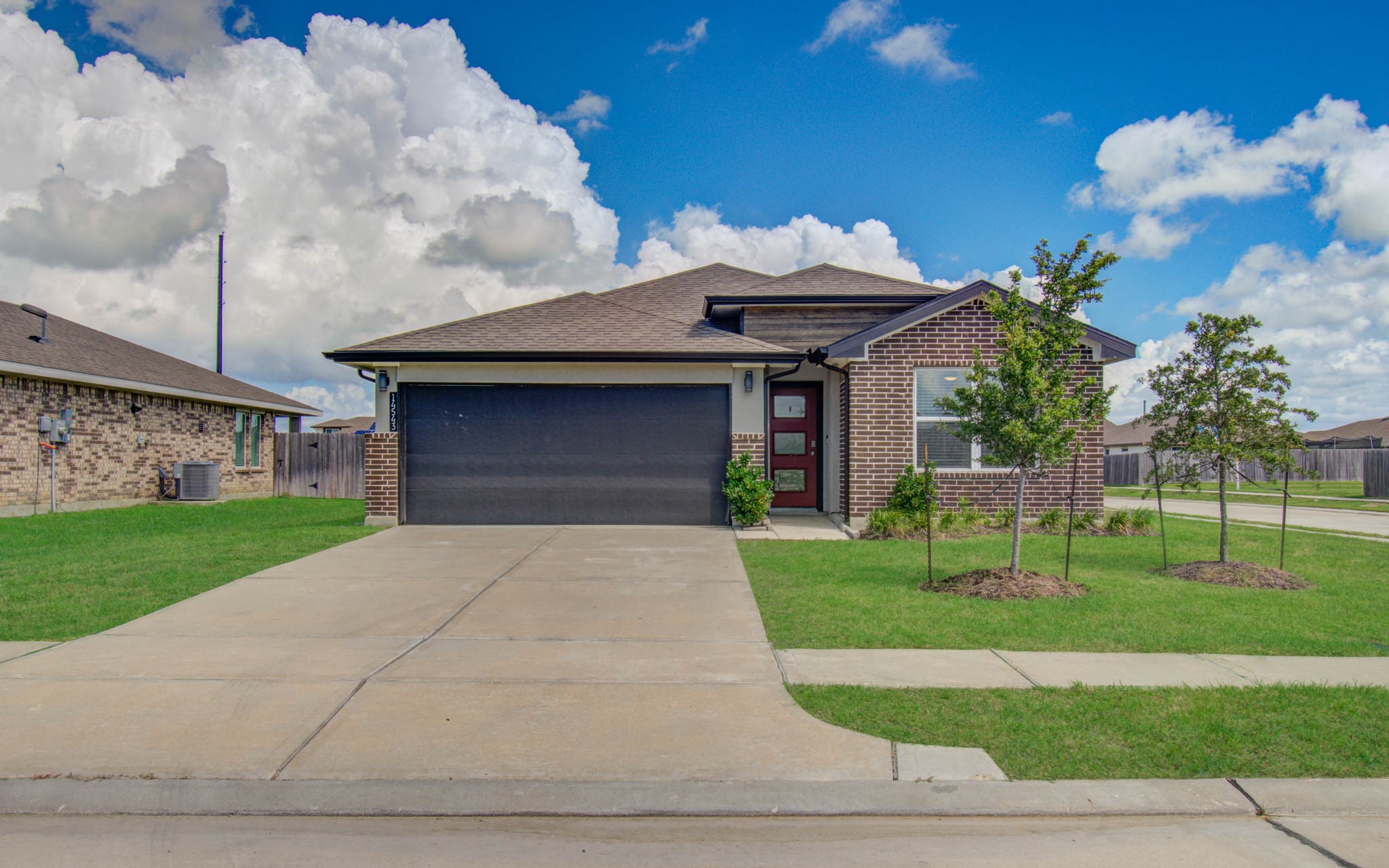 14543 Raintree Drive Baytown, TX 77523 - Photo 2 of 37 Double-wide driveway w/ 2-car garage!