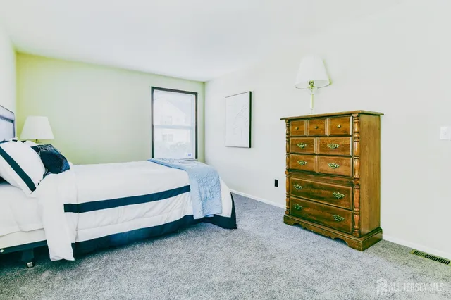 a bedroom with a bed and a cabinets