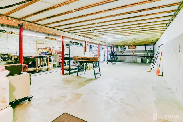 a view of a patio with table and chairs